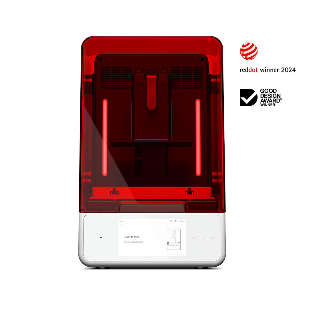 3D printer with red transparent lid on a white background, featuring Good Design Award Winner and Red Dot Award Winner logos.