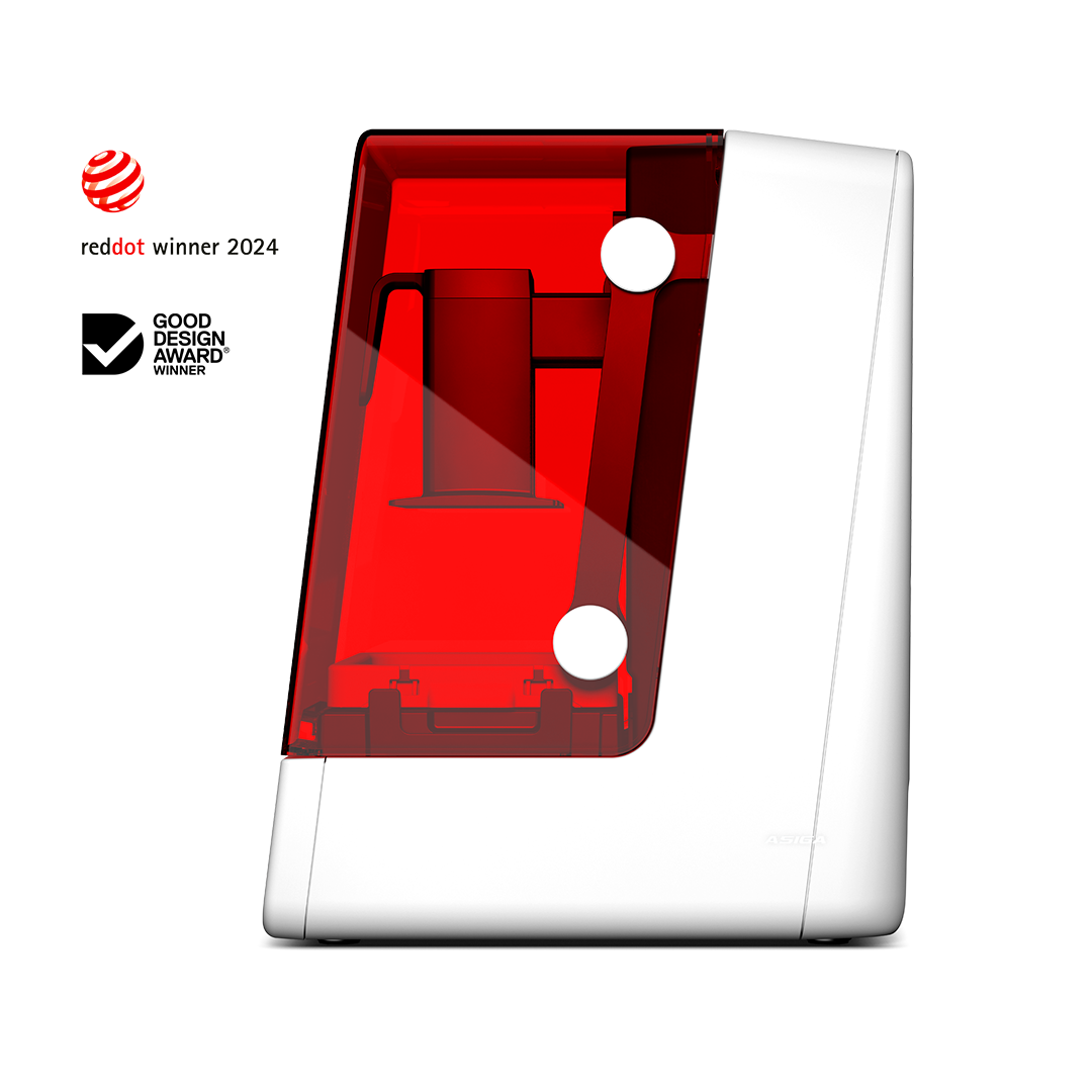 3D printer with red transparent lid on a white background, featuring Good Design Award Winner and Red Dot Award Winner logos.