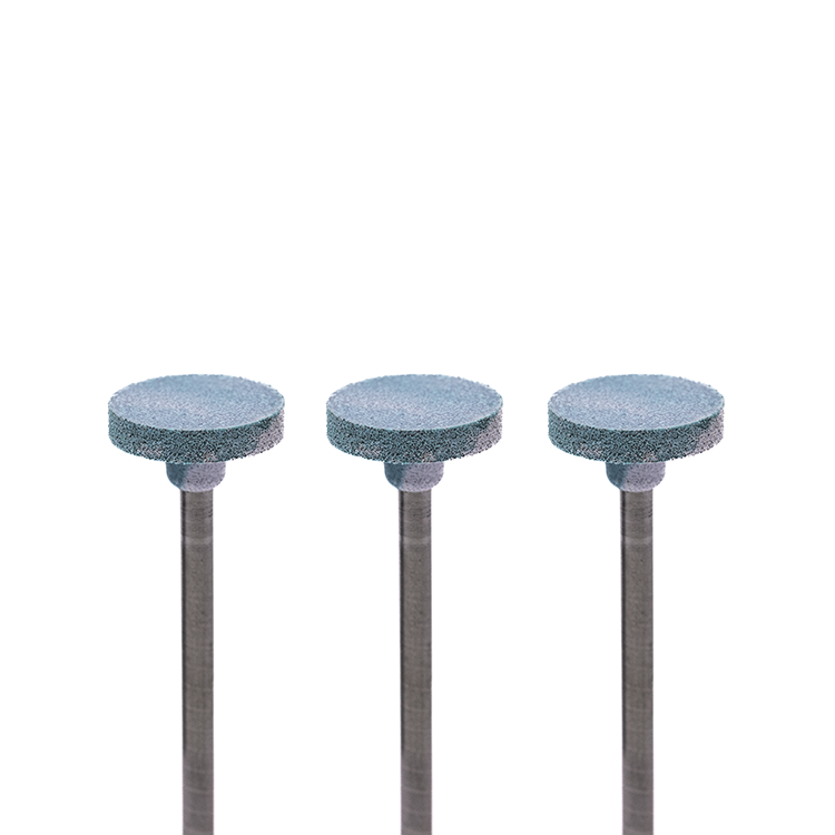 Set of three blue-and-white colored disc-shaped rotary burs on a white background.