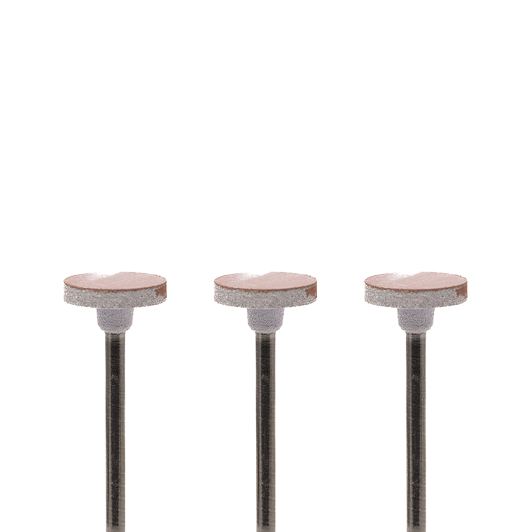 Set of three red-and-white disc-shaped rotary burs on a white background.