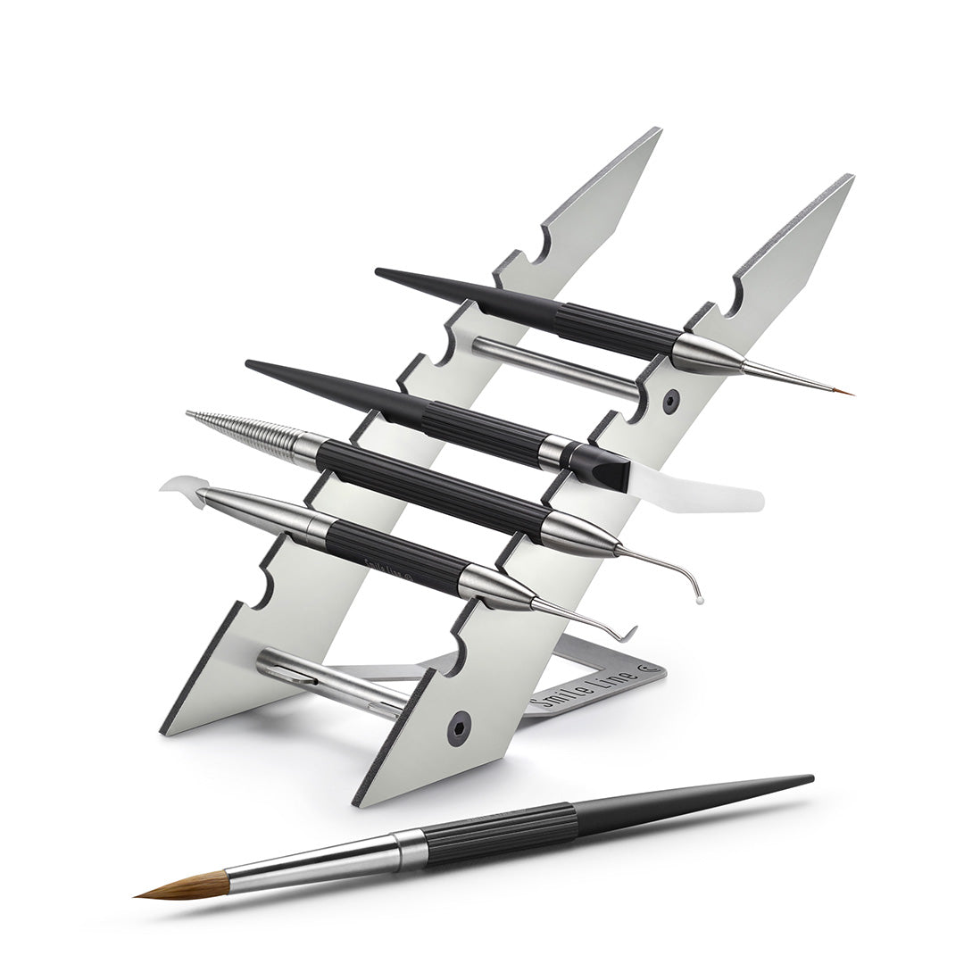 A metal stand designed to hold dental characterization instruments.