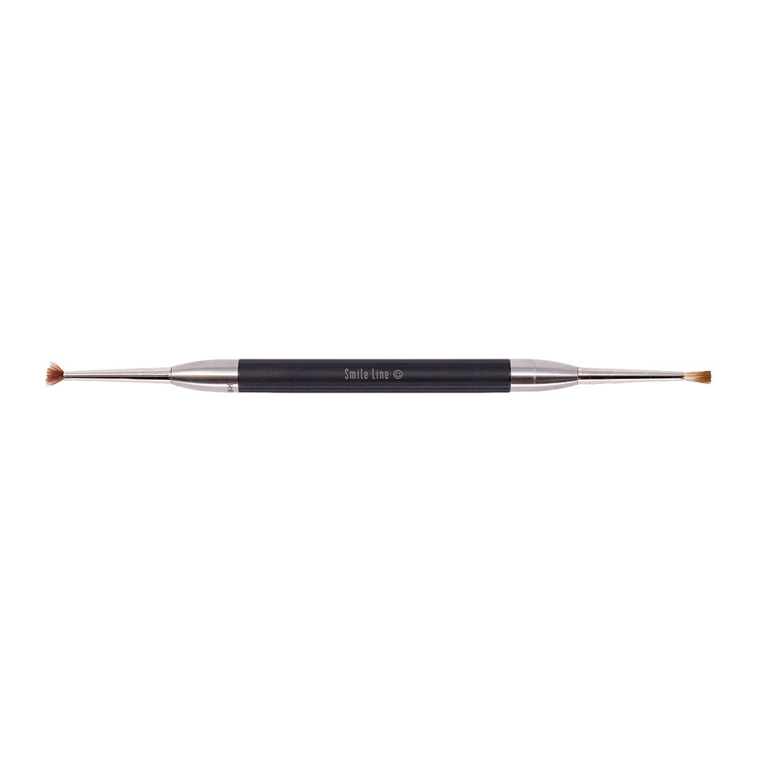 A Smile Line Gum Brush, with a black handle and double-ended with different brushes on each side.