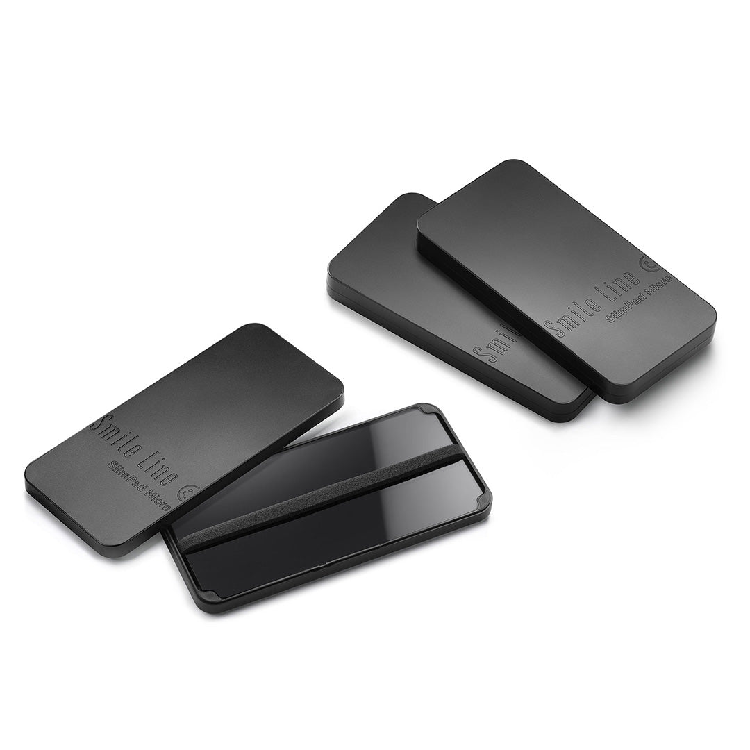 Three Black Smile Line Slimpad Micros arranged on a white background.