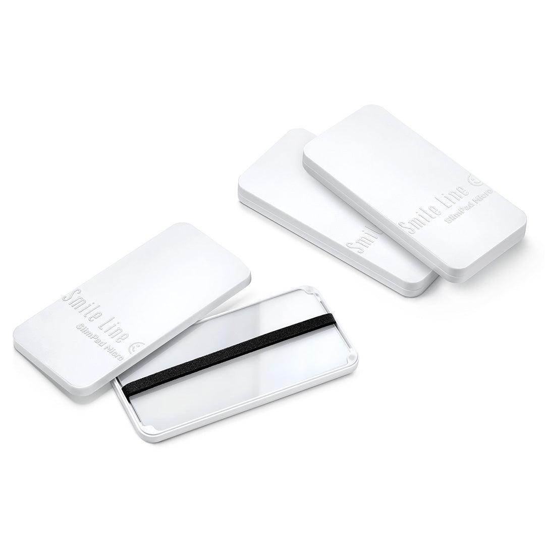 Three White Smile Line Slimpad Micros arranged on a white background.