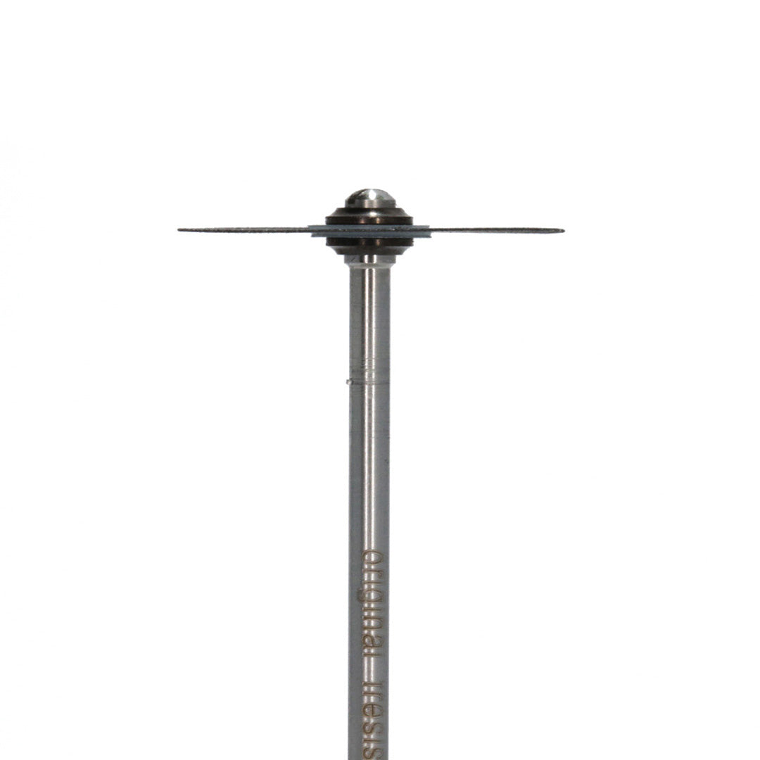 Side view of a thin sintered diamond disc attached to a mandrel.