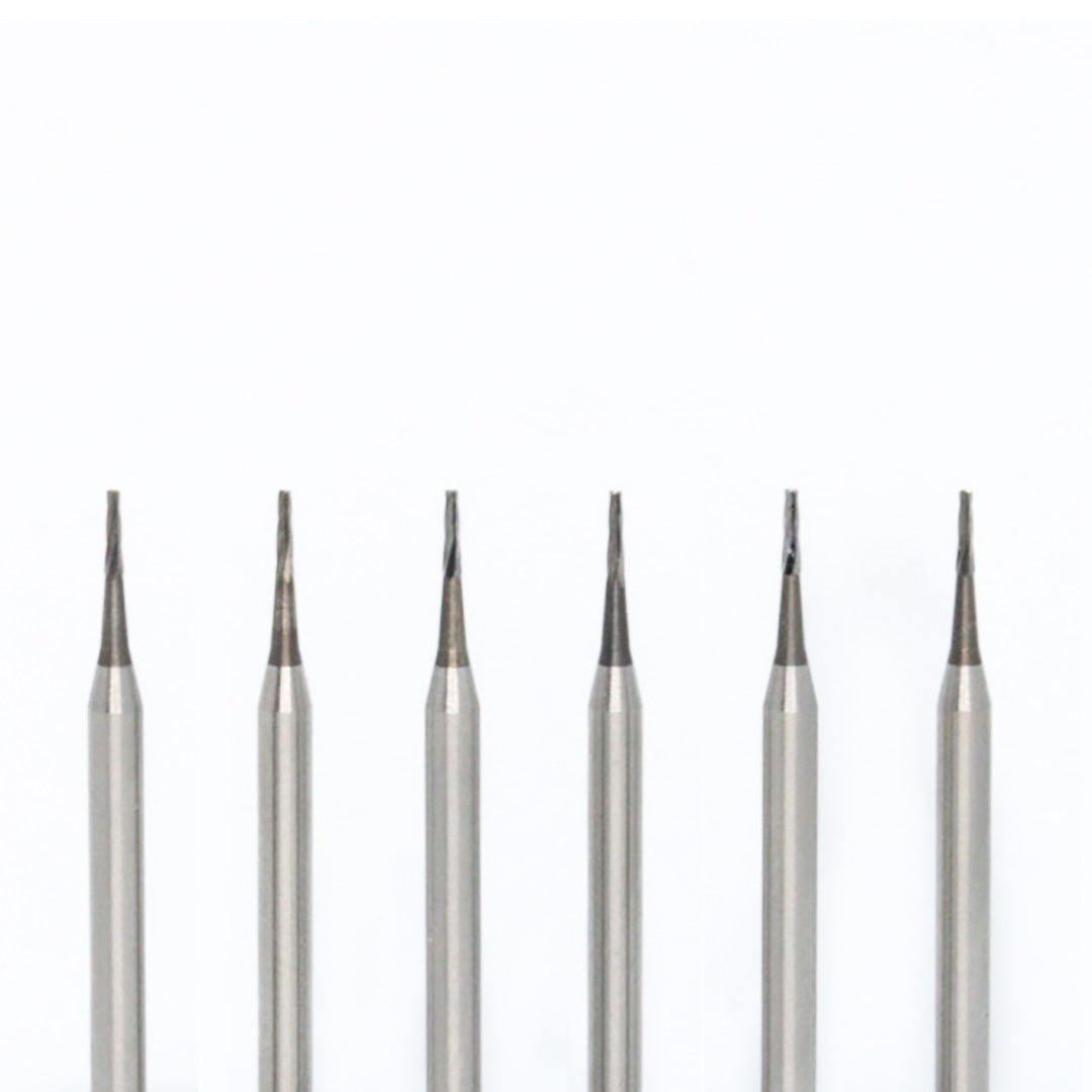 Set of 6 conical-point needle carbide rotary burs on a white background.