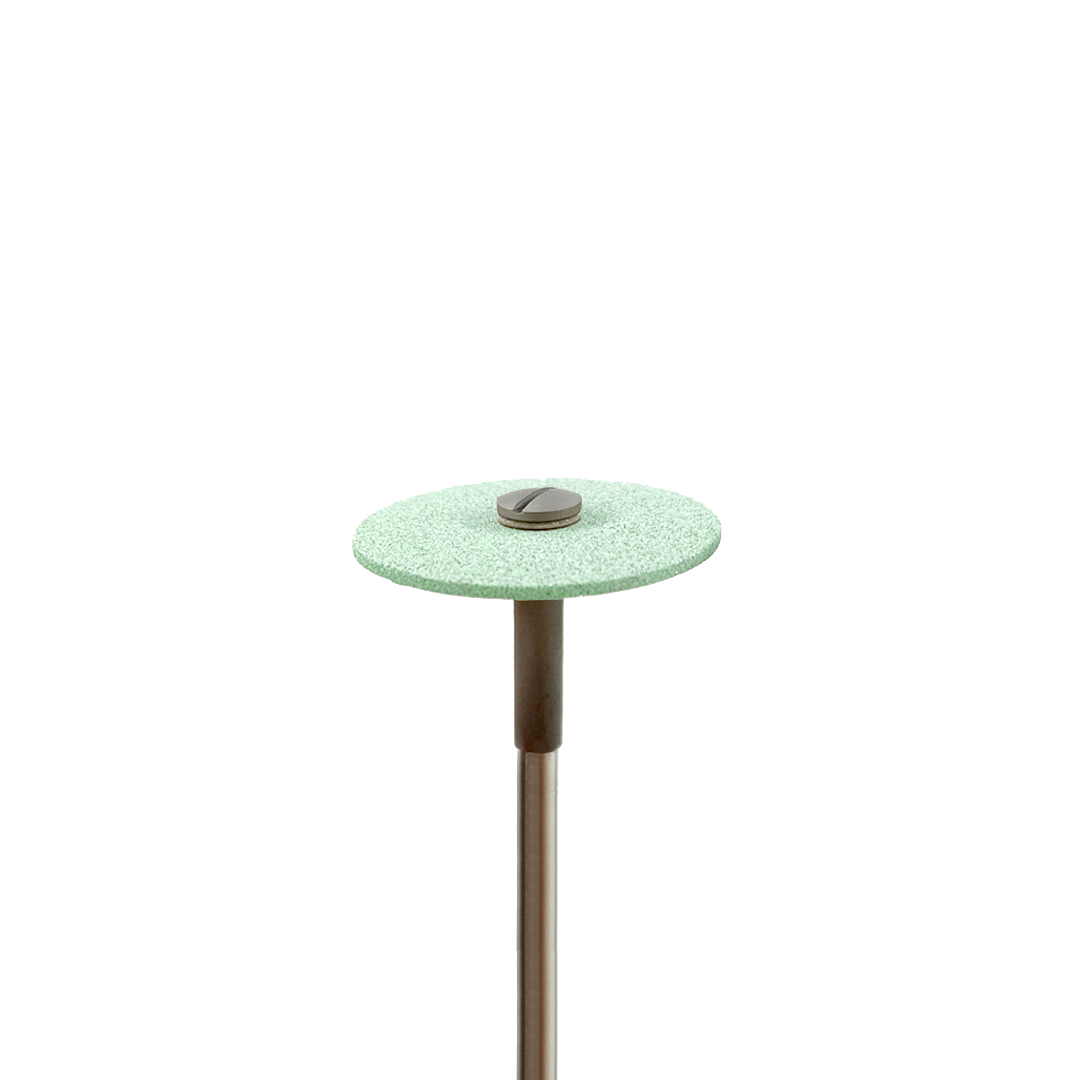 A green, thin, disc-shaped contouring tool on a white background.