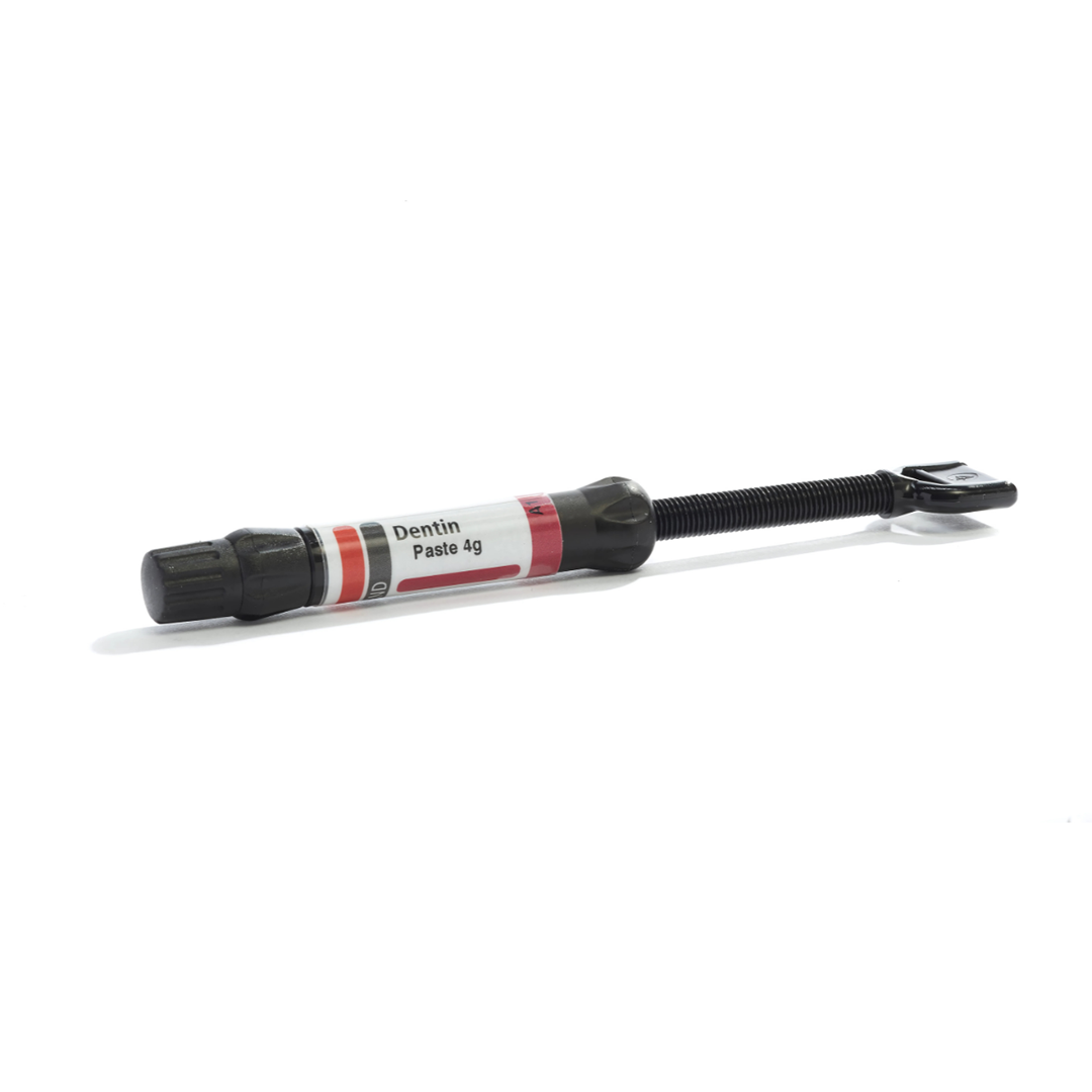 Syringe of dental material on a white background.