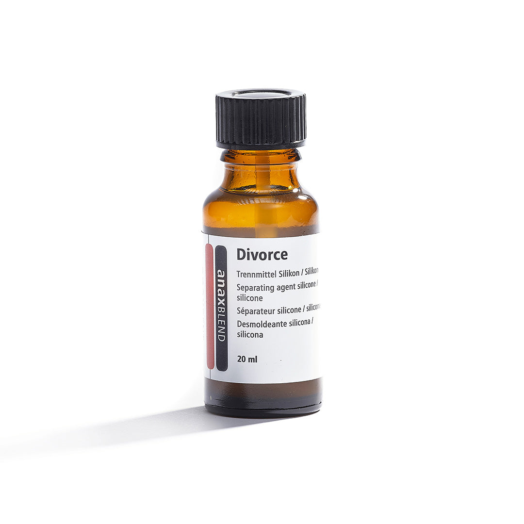 A 20ml bottle of silicone separating agent. Bottle is a clear brown with a white label that says "anaxblend Divorce".