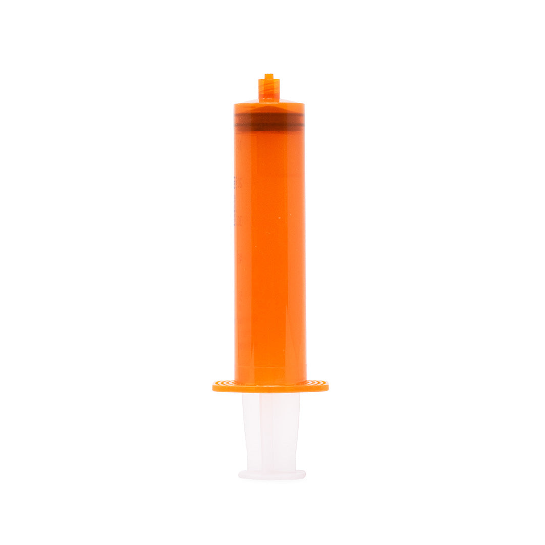 An orange PMMA injector placed against a white background.