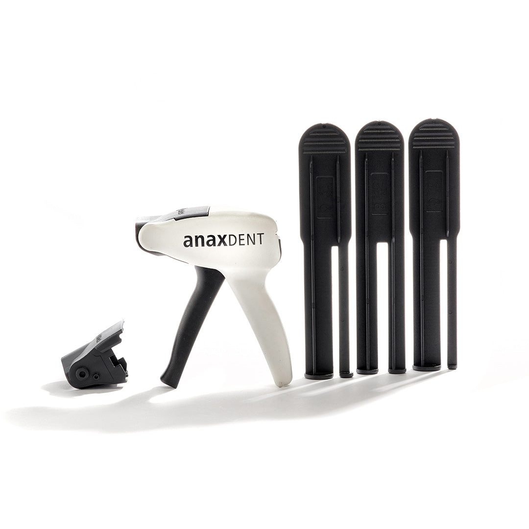 A dental universal dispensing gun with multiple tips on a white background.