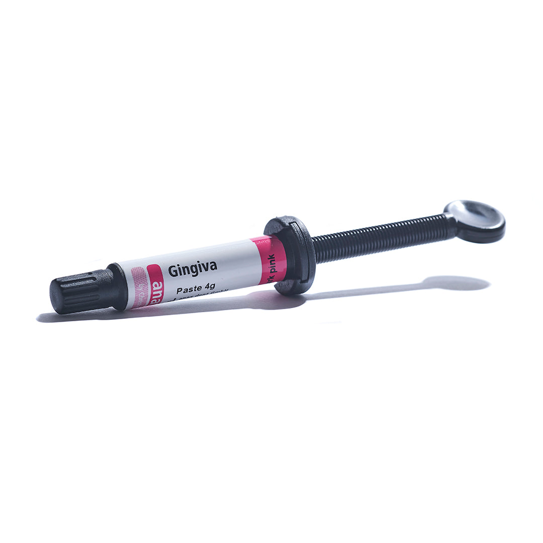 A syringe of anaxgum gingiva paste on a white background.
